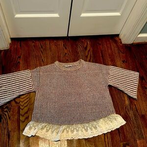 THML. Brown striped sweater with lace hem.
Hand wash or dry clean.